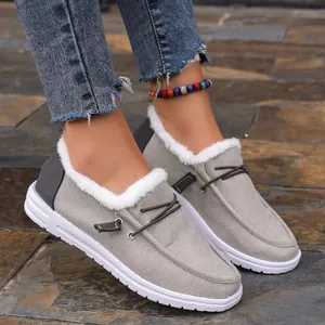 Detail view of warm gray plush-lined low-top platform loafers with faux fur collar
