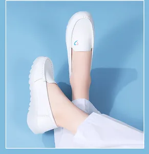 Comfortable white nurse shoes with thick non-slip soles and colorful heart detail