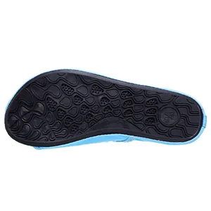 Detailed close-up view showing the anti-slip rubber sole of a light blue water beach shoe