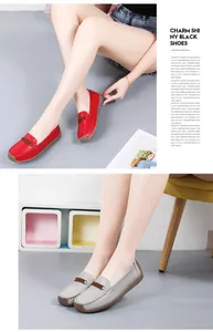 Detail view showing red and grey leather loafers with soft soles for comfortable walking