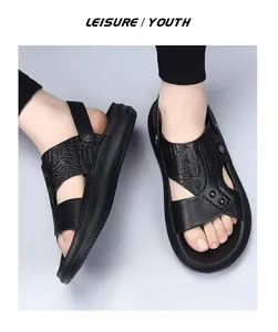 Detailed top view of men's black genuine leather sandals with embossed crocodile texture