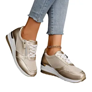 Baskets compensées dorées pour femmes avec lacets et détails de fermeture éclair