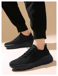Side view of lightweight black fly-knit sneakers with non-slip soft soles for walking