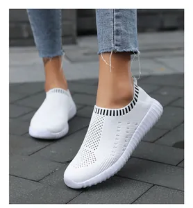 Close-up of white breathable mesh slip-on sneakers for women outdoor wear