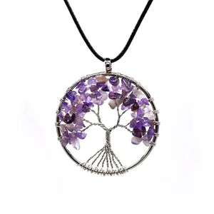 Detailed macro view of the tree of life pendant with amethyst and silver wire wrap.