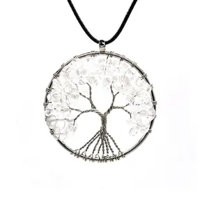 Detailed view of handmade wire wrapped Tree of Life pendant with clear quartz stones