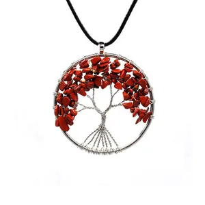 Detailed view of handmade Tree of Life pendant with red crushed stones and silver wire