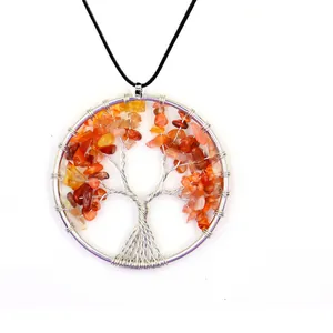 Close-up of wire wrapped Tree of Life pendant with red carnelian stone chips