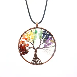 Macro detail of Tree of Life pendant with colorful natural stone chips and copper wire