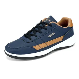 Waterproof navy blue leather sneakers for men with brown accents and white sole.