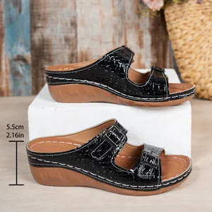 Classic black croc-pattern wedge sandals with double buckle straps and 5.5cm heel.