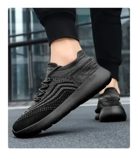 Close-up of lightweight breathable mesh men's running shoes in dark grey pattern