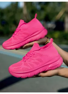 Comfortable vibrant pink fly-woven slip-on sock shoes with thick soles for sport