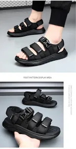 Detail view of men's black sports sandals with adjustable straps and SPORT label