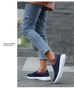 Close-up of women's breathable knit sneakers showing the slip-on design and sole texture