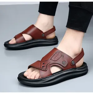 Macro view of men's brown genuine leather sandals with embossed sport text on the side.