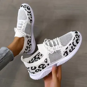 Close-up detail of leopard print breathable mesh sneakers with white laces and sole