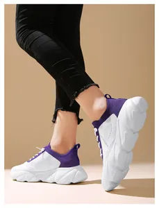 Side view of white and purple fly-knit sneakers with anti-slip thick soft sole