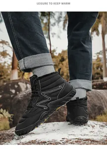 Men's high-top winter snow boots with fleece lining shown in outdoor hiking scene.