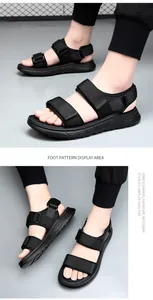 Close-up detail of black men's sports sandals with adjustable velcro straps.