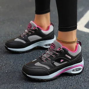 Women's stylish lightweight athletic running shoes in black and pink with air cushion soles