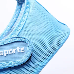 Detailed macro shot of blue breathable mesh material and sports logo on beach shoes
