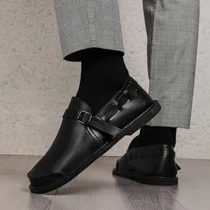 Side view detail of handmade black vintage leather loafers for men with wide toe