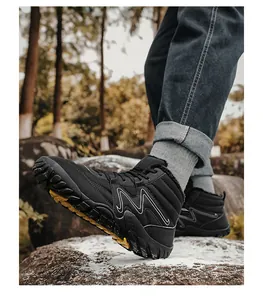 Detailed view of high-top black winter snow boots with warm lining and anti-slip sole.