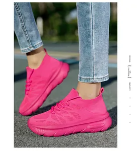 Vibrant hot pink fly-knit sock sneakers featuring thick platform soles for outdoor sports