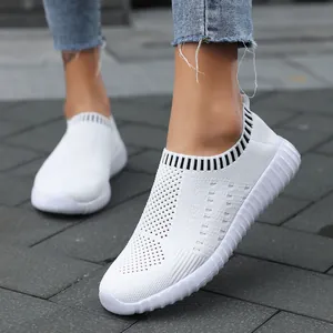 Women's white knitted slip-on walking shoes with breathable mesh and ribbed sole