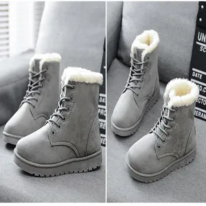 Warm grey faux fur lined winter Martin boots with thick soles and lace-up design