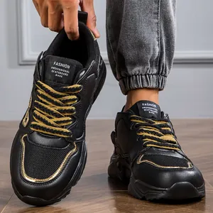 Detailed view of fashionable black and gold chunky sneakers with durable leather