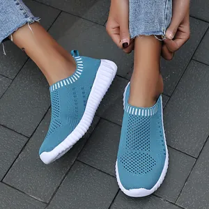 Breathable teal knit slip-on sneakers for women featuring thick white textured soles