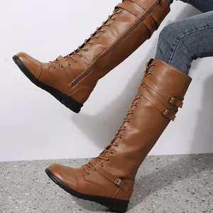 Stylish tan knee-high lace-up knight boots with side zipper and side buckle detail