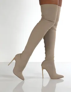 Detailed view of khaki knit thigh-high stiletto boots with a sleek pointed toe