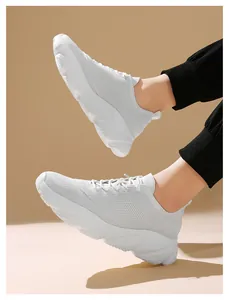 Lightweight white fly-knit sneakers with soft anti-slip soles for casual walking.