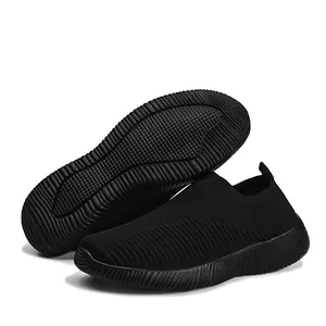 Black fly-knit slip-on walking shoes for women with flexible soft sole and mesh upper