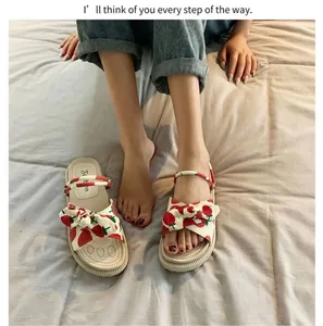 Stylish women's strawberry print bow sandals with thick platform sole for summer outings