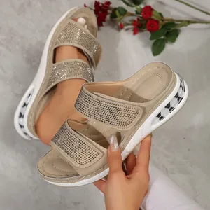 Macro view of beige platform sandals featuring shimmering rhinestones and air-cushioned sole
