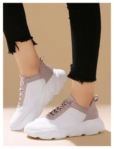 Detailed side view of lightweight women's fly-knit sneakers with slip-on design