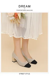 Close-up of beige ribbed square toe chunky heel pumps with black tip details