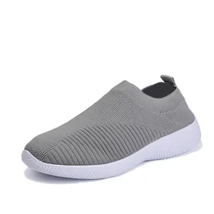 Comfortable lightweight grey fly-knit sock sneakers for women with soft white soles