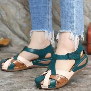 Retro color-block wedge sandals with cross-strap design for women's summer style.