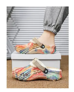 Detail view of winter fleece-lined clogs with colorful palm leaf pattern and warm lining