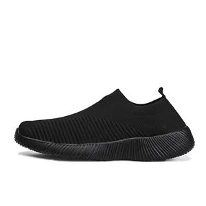 Side view detail of comfortable lightweight black flyknit slip-on sneakers for women