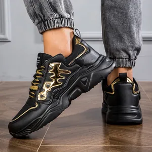 Close-up of black and gold chunky dad sneakers for men featuring a thick sole design