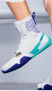 Detail view of professional high-top boxing shoes with anti-slip soles for training
