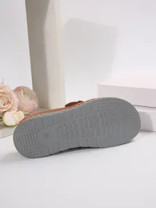 Detailed macro view of the non-slip textured sole of ladies platform slippers