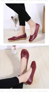 Detailed shot of burgundy leather loafers for women showing the soft leather texture.