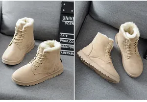 Detailed close-up of beige faux fur-lined winter ankle boots with lace-up design for women